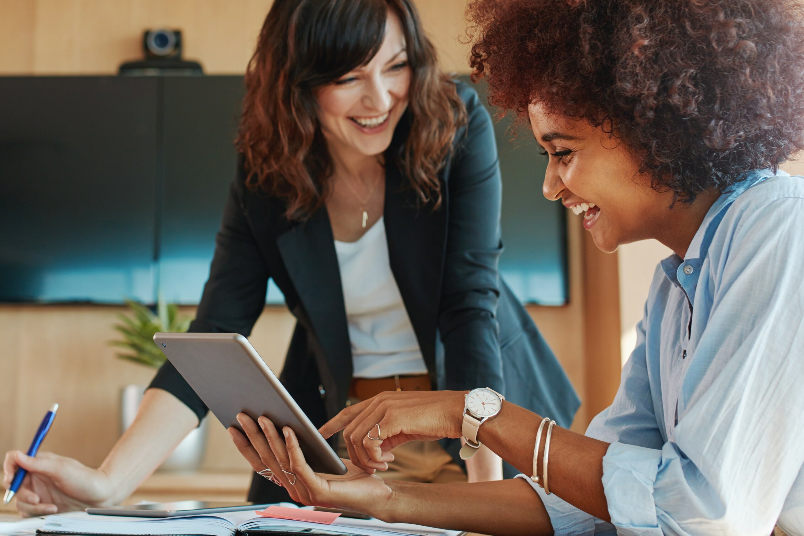 business woman smiling at desk