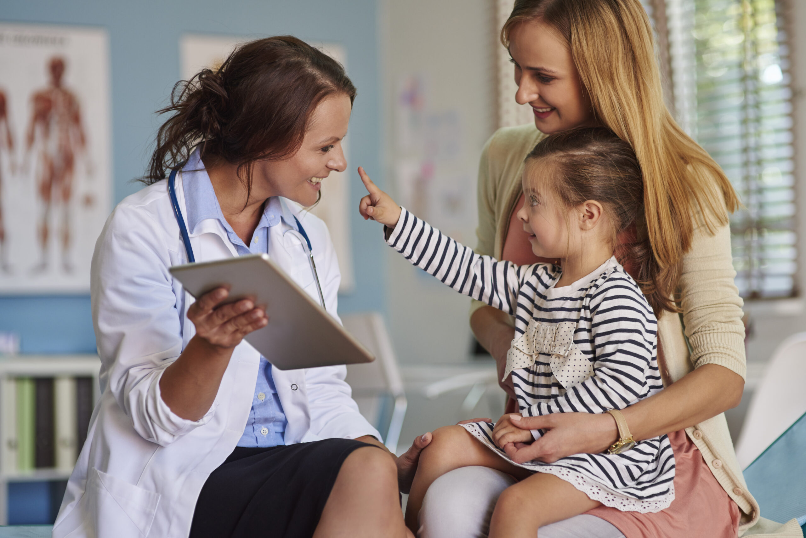 Child patient interacting with doctor