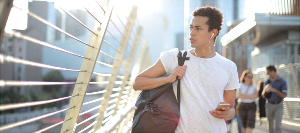 Man walking listening to headphones