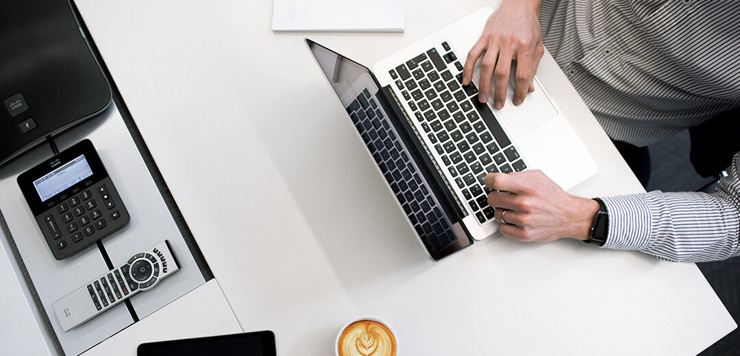 Man typing on laptop