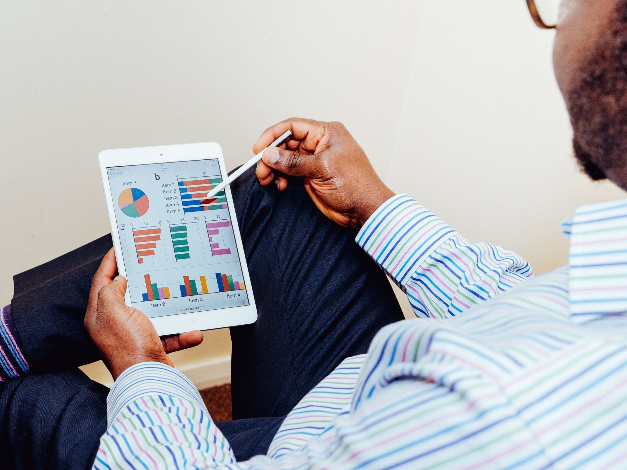 Man reviewing dashboard on tablet