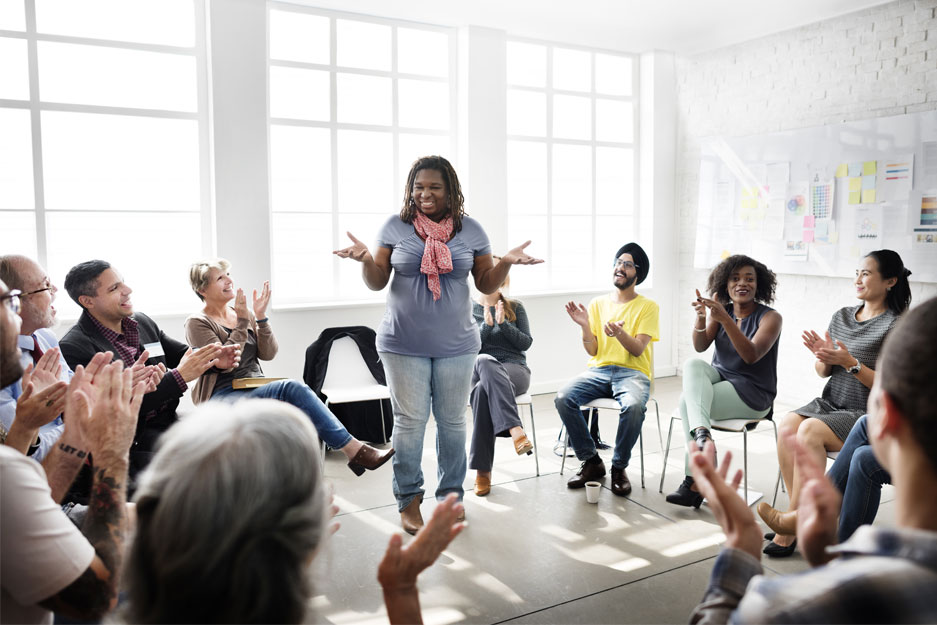 Woman talking to group of people