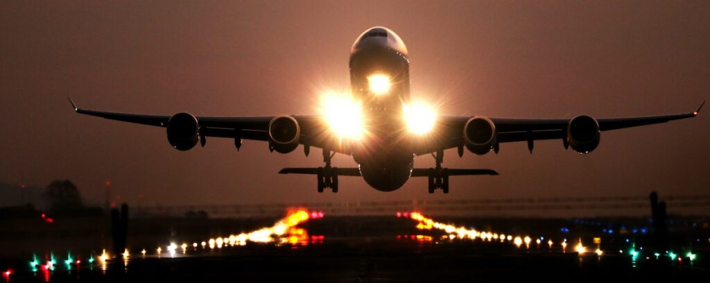 plane taking off at twilight