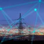 abstract image showing data points against a backdrop of utility poles and a city lanscape