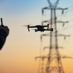 unlocking-the-power-of-asset-image-analytics-banner utility worker flying a drone near power lines