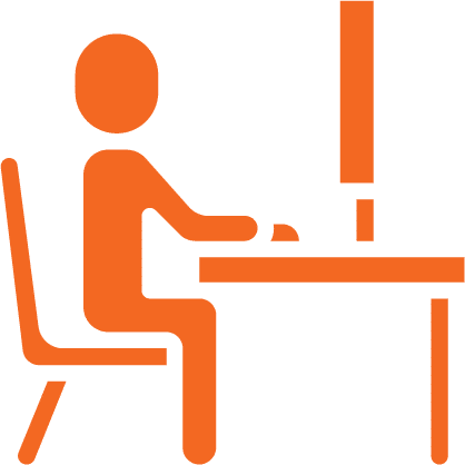 icon of a person working at a computer at a desk
