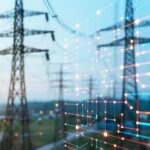 daytime photo of transmission towers overlaid by abstract image representing digital technology