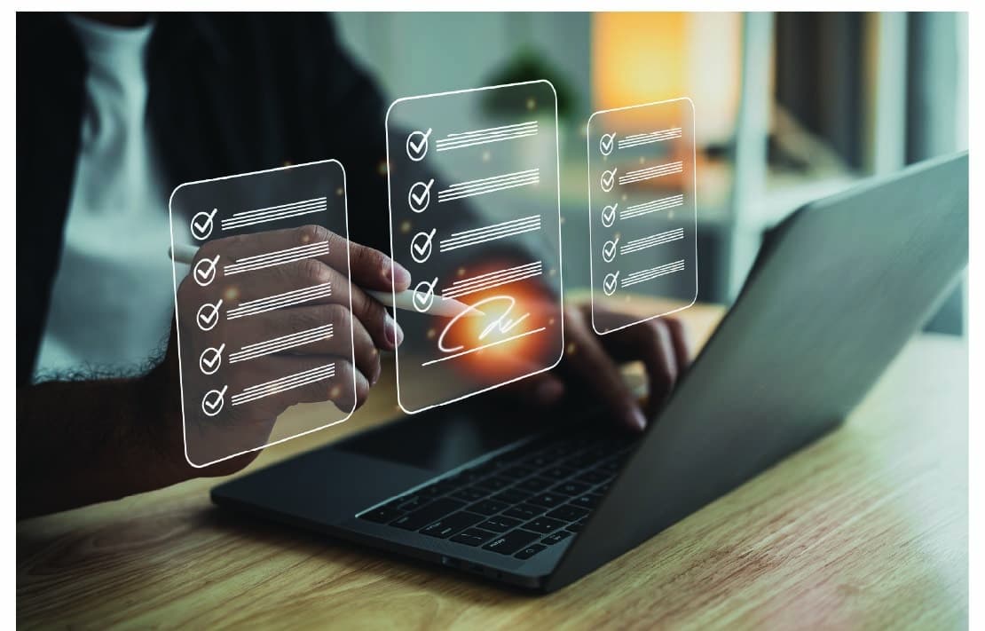 person using laptop computer with digital overlaps representing documents for signature