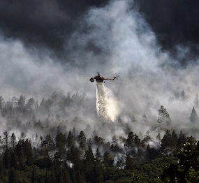 helicopter responding to a forest fire